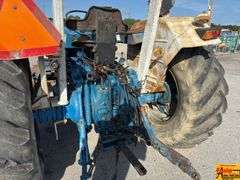 Ford 7000 Tractor with Woods DuAl loader & hay fork attachment. 3,355 hrs.  Runs good.  See video.