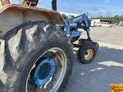 Ford 7000 Tractor with Woods DuAl loader & hay fork attachment. 3,355 hrs.  Runs good.  See video.