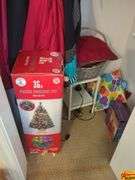 Contents Of Closet:  Christmas Decorations, Santa Figure, Apparel & More