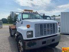 1999 GMC 7500 Flatbed Truck; 80,634 Miles; VIN 1GDM7H1C0XJ505041.  See video.