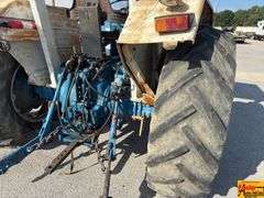 Ford 7000 Tractor with Woods DuAl loader & hay fork attachment. 3,355 hrs.  Runs good.  See video.