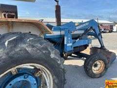 Ford 7000 Tractor with Woods DuAl loader & hay fork attachment. 3,355 hrs.  Runs good.  See video.