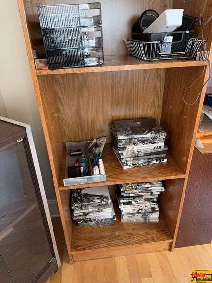 Contents Of Bookshelves:  office supplies, DVDs image