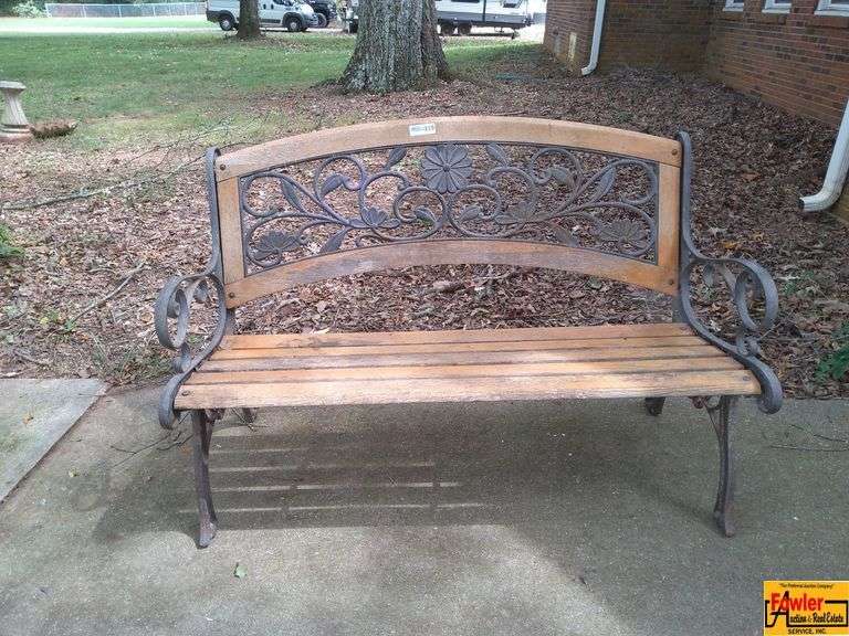 Wooden Outdoor Bench with Ornate Ironwork image