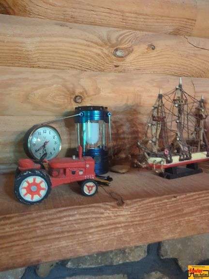 Items On Mantel:  die cast tractors, lantern, model ship, clock, collectible "Bama" Coke & figurines image