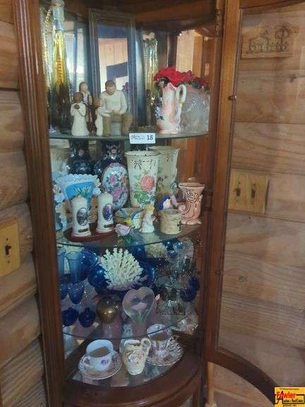 Contents Of Cabinet:  Willow Tree figurines, ceramic swan vase, vintage Avon Thomas Kinkade Hidden Cottage salt & pepper shakers set collection, vintage pink cornucopia vase with rose design and gold accents, cobalt blue vases, & bowl, pink depression butter dish, collectible tea cups with saucers & more image