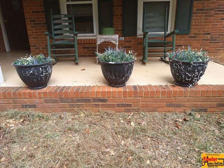 Three Decorative Outdoor Planters with Flowers image