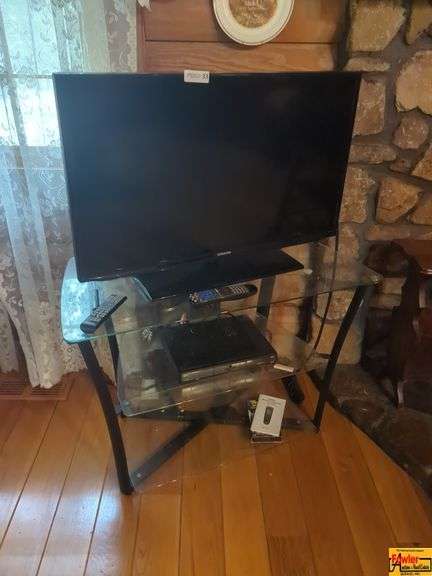 Samsung Flat Screen TV, Accessories On Glass Entertainment Stand image