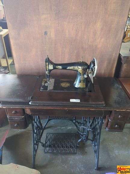 Ornate Treadle Sewing Machine with Cabinet image