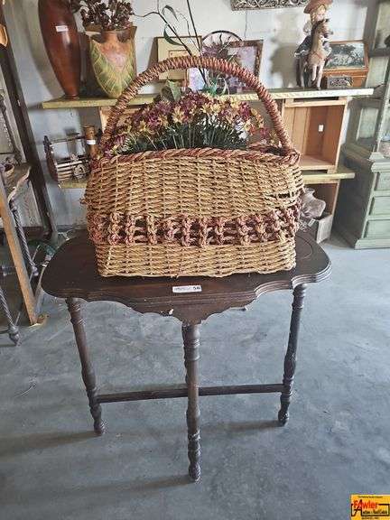 Wicker Basket with Flowers and Wooden Accent Table image