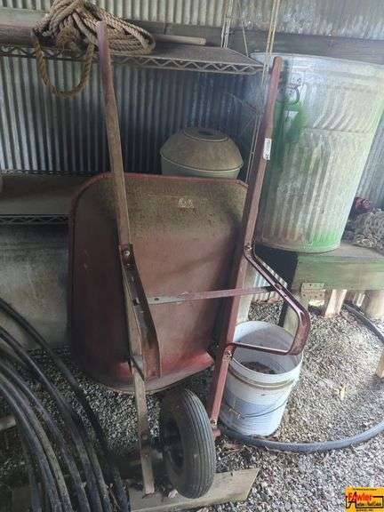 Wheelbarrow, Log Chain and Galvanized Trash Can image
