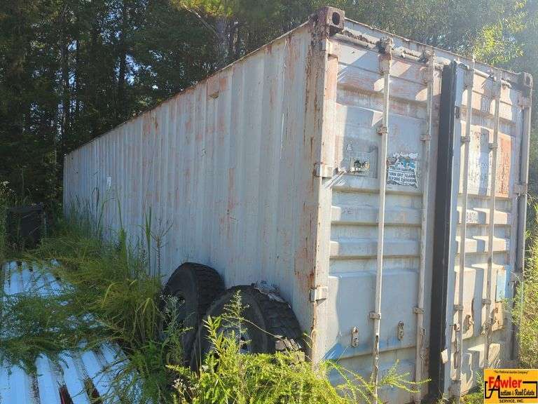 Shipping Container with Tires and Materials image