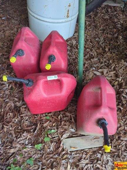 4 Red Plastic Gas Cans image