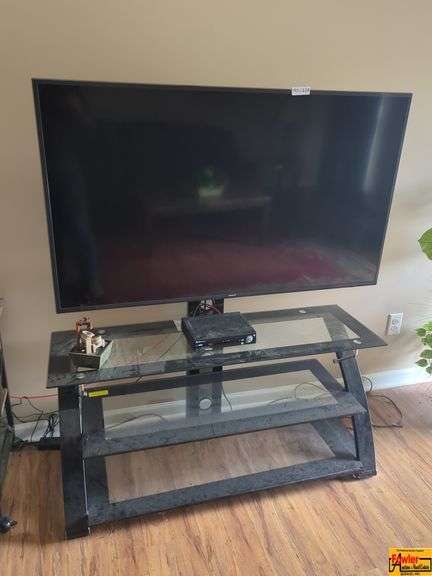 Flat Screen TV and Glass Shelf Media Stand image