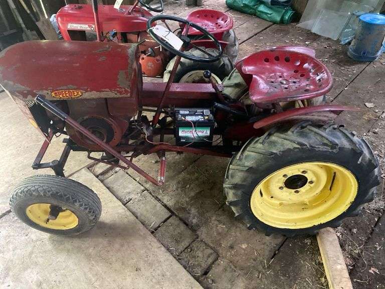A Speedex Tractor 62 Inches Long, 8 Horse Briggs, Original Paint and Motor Used Very Little