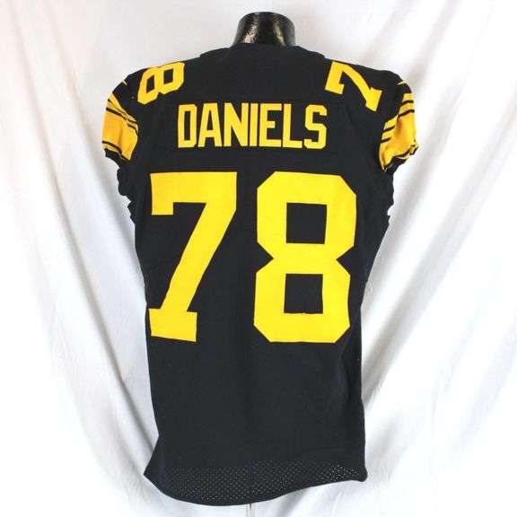 Pittsburgh Steelers #78 James Daniels Game Used Color Rush Jersey. Nike Color Rush unlaundered jersey worn by offensive lineman James Daniels during the December 7, 2023 game against the New England Patriots at Acrisure Stadium. Jersey has a 2019 year tag and the GW-23 tag installed by the equipment team indicating use in 2023. Jersey has transfer, stains, scrapes, loose threads and other signs of wear. Daniels played 100% of the snaps in the game. Each autographed and game-used item is personally authenticated by Pittsburgh Steelers Authentic Memorabilia. Each memorabilia item is affixed with an individually numbered, tamper-evident hologram or vinyl patch which can be verified online ensuring that this item is authentic and eliminating the possibility of fraud. image