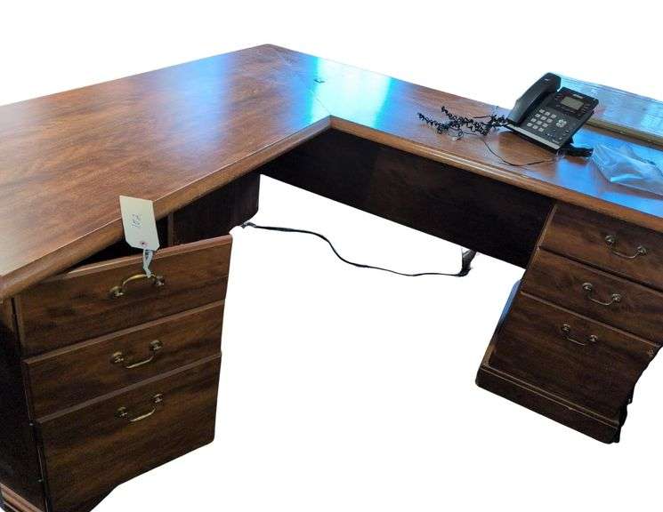 L-Shaped desk 5.5 F x 5.5 F , Verizon Desk Phone, 2 Drawer Filing Cabinet. Paper Trays. Computer Cables. Covered Garbage Can image