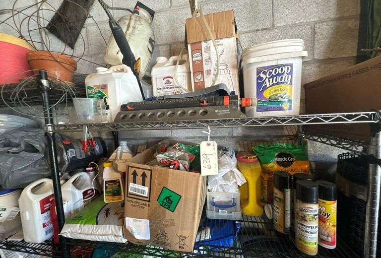 Contents of Top Two Shelves  - Lawn and Garden Product - Lawn Sprinklers  - Sprayers -  Bug Spray - Weed/Grass Product - Etc. image