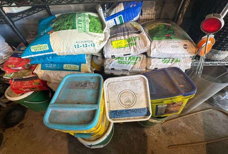 Contents of Bottom 2 Shelves - Several Bags of Pelletized Limestone Neutralizer - Bags of Fertilizer - Lime - Other Product image