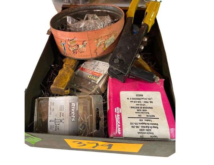 A 9x12.5x3 Inch Metal Tray of Rivets and a Rivet Gun image