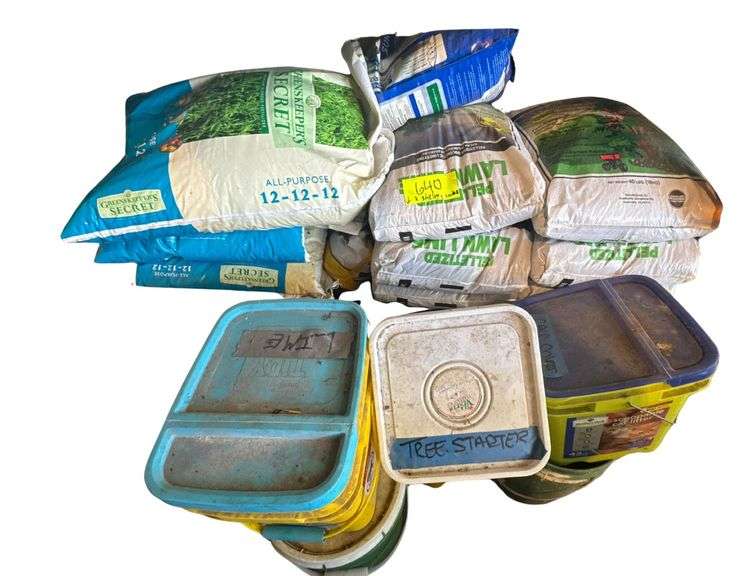 Contents of Bottom 2 Shelves - Several Bags of Pelletized Limestone Neutralizer - Bags of Fertilizer - Lime - Other Product image