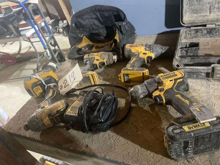 4 DeWalt Tools 2 Brushless Drills and 2 Impact Drills 2 Batteries and a Charger image