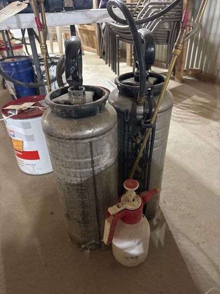 Pair of Pump Sprayers and Smaller Handheld Sprayer image