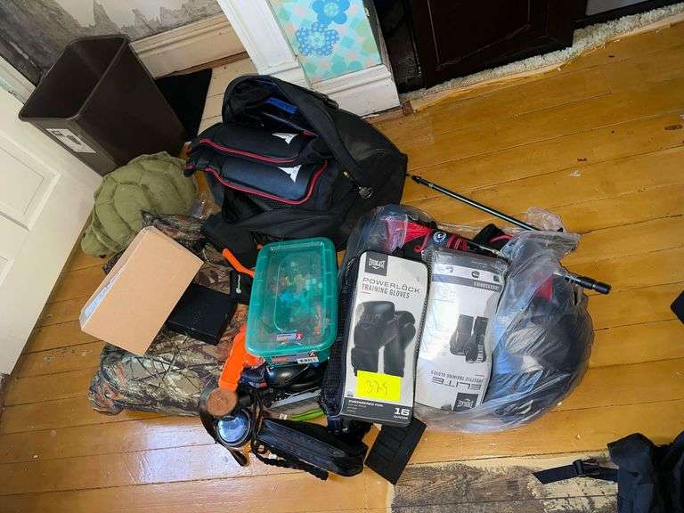 Contents On Floor Includes Bb Gun Items Boxing Gloves Turtle Pillow Duffle Bag