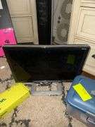 Plastic Tote Of Hair Products Hang On Tabletop TV Stand Magic Shade Gateway Computer Monitor