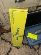 Plastic Tote Of Hair Products Hang On Tabletop TV Stand Magic Shade Gateway Computer Monitor
