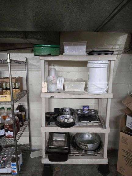 Plastic Shelf and Contents Including Large Metal Bowls, Large Colander, Fry Pans, Muffin Tins, Plastic Food Buckets. Shelf 63 in. T x 36 in. W x 17 in. D