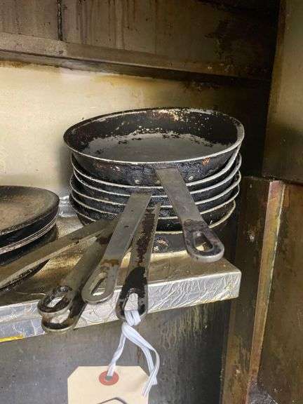 A Collection of Well Seasoned Cooking Pans