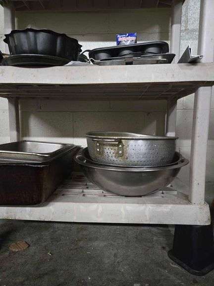 Plastic Shelf and Contents Including Large Metal Bowls, Large Colander, Fry Pans, Muffin Tins, Plastic Food Buckets. Shelf 63 in. T x 36 in. W x 17 in. D