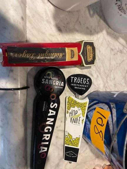 Approximately 8 Beer Taps in a Budweiser Bucket
