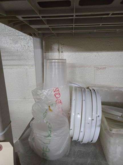 Plastic Shelf and Contents Including Large Metal Bowls, Large Colander, Fry Pans, Muffin Tins, Plastic Food Buckets. Shelf 63 in. T x 36 in. W x 17 in. D