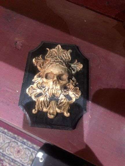 Various Decorative Items Including Faux Flower, Skull Wall Piece, Stick Dummy, 2 Head Figurines, Elephant Statue, 2 Antelope Statues, Golden Pumpkin, and Bird with Crown Statue