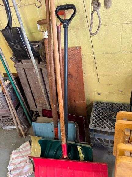 All Items on Right Hand Wall of Garage, Including Hoses, Rakes, Brooms, Shovels, Extension Cord, Creeper, Rope, Buckets, Watering Cans