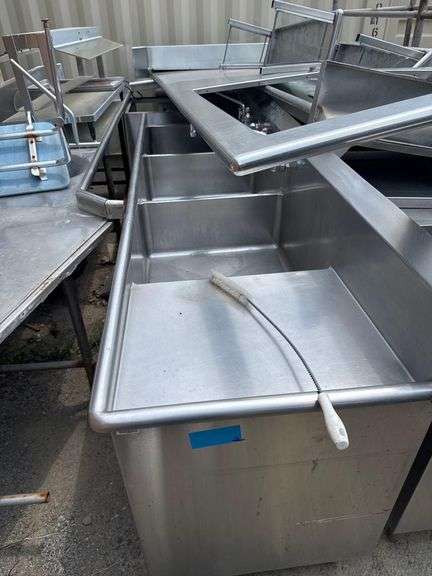 Large Lot of Stainless Steel Tables and Sinks - Including a 9’ Stainless Table, 8’ Table w Drawer, 3 Basin Sink, 12x8 L Shaped Table, 2 Table Top Shelves, 6’ Chest w/ Hand Washing Sink