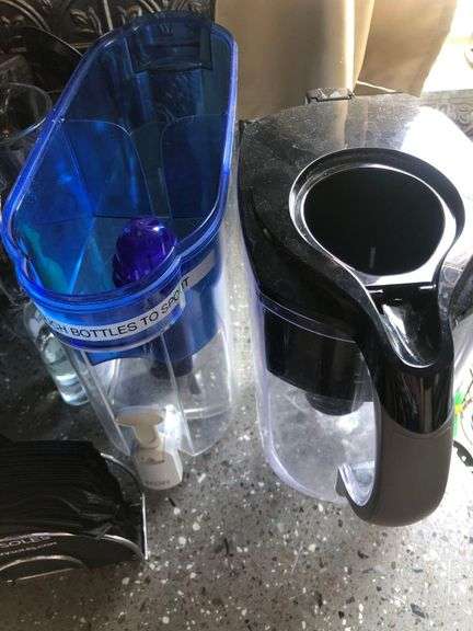 Contents of Counter Including Keurig, Bread Toaster, Euro-Pro Toaster Oven, Drying Rack, Kitchen Utencils, Water Filtration Pitchers