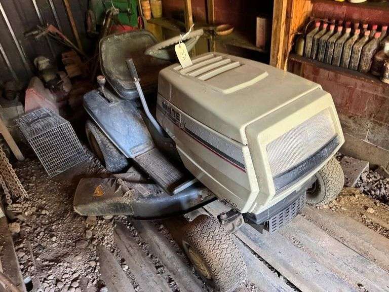 White 15.5 HP Garden Tractor - This mower hasn't been used in years, so it will require some maintenance, but it was in good working order when it was parked.