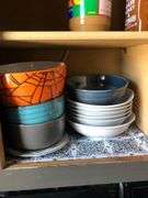 All Contents of Cupbards Including Metal Utencils, Glass Mugs, Glass Plates and Bowls, Plastic Spoons, Cleaning Rags, Wine Glasses, Kitchen Utencils, Plastic Bags, Broom and Dustpan