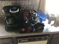 Contents of Counter Including Keurig, Bread Toaster, Euro-Pro Toaster Oven, Drying Rack, Kitchen Utencils, Water Filtration Pitchers