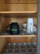 All Contents of Cupbards Including Metal Utencils, Glass Mugs, Glass Plates and Bowls, Plastic Spoons, Cleaning Rags, Wine Glasses, Kitchen Utencils, Plastic Bags, Broom and Dustpan