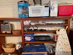 Large Lot on Wall Including Decorative Flags, Ice Skates, Heater, Misc. Items