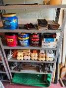 2 Metal Shelves and Contents which include Golfing Mats, Golf Balls and etc.