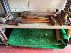2 Metal Shelves and Contents which include Golfing Mats, Golf Balls and etc.
