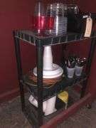 Black Plastic Cart Without Wheels, Plastic Cups, Plates, and Utensils, Various Kitchen Utensils, Extention Cord, Paper Towels