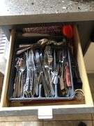 All Contents of Cupbards Including Metal Utencils, Glass Mugs, Glass Plates and Bowls, Plastic Spoons, Cleaning Rags, Wine Glasses, Kitchen Utencils, Plastic Bags, Broom and Dustpan