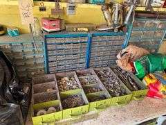 Workbench Contents - Loaded with Hardware - Nuts, Bolts, Screws, Bits, Battery Charger, Including Hand Tools Under Bench - Does Not Include Bench Vise
