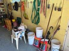 All Items on Right Hand Wall of Garage, Including Hoses, Rakes, Brooms, Shovels, Extension Cord, Creeper, Rope, Buckets, Watering Cans
